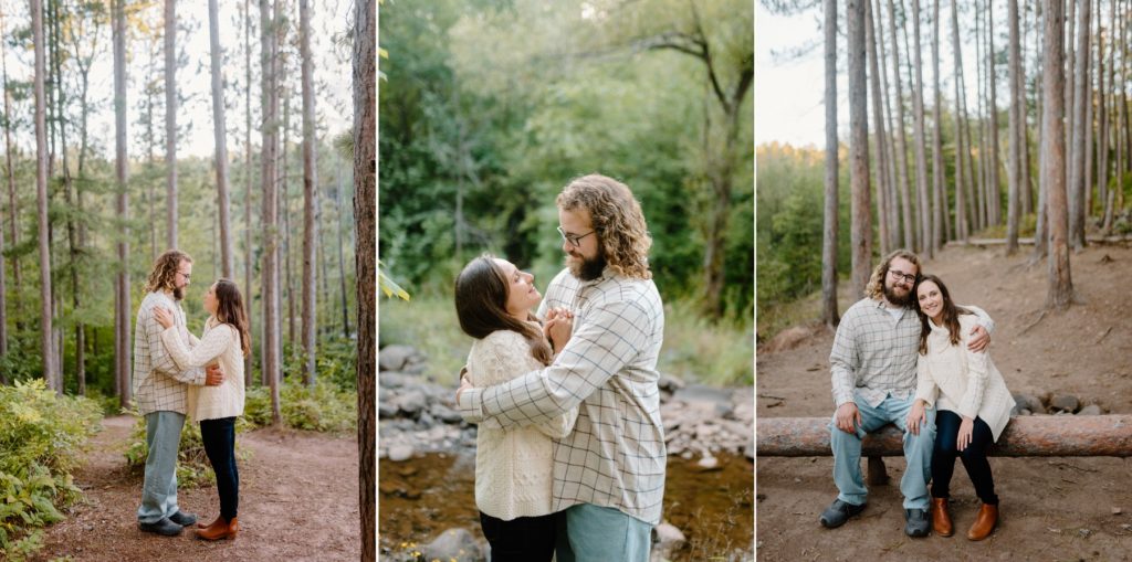 Couple hugging in wooded area.