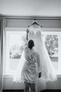 Bride looking at her wedding gown