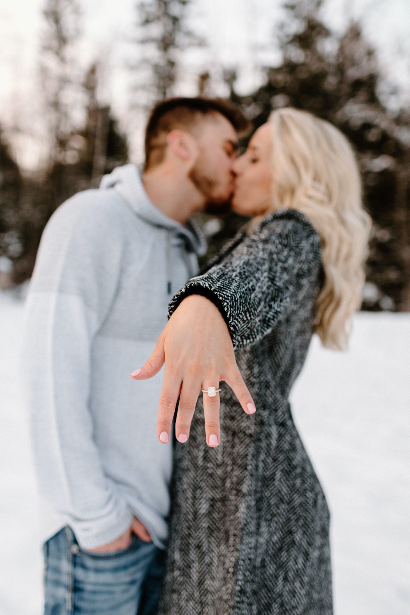 Engaged couple showing off their ring
